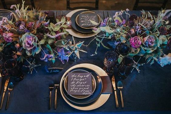 navy blue table cloth and dinner plate purple centerpiece for navy blue purple blue fall wedding colors